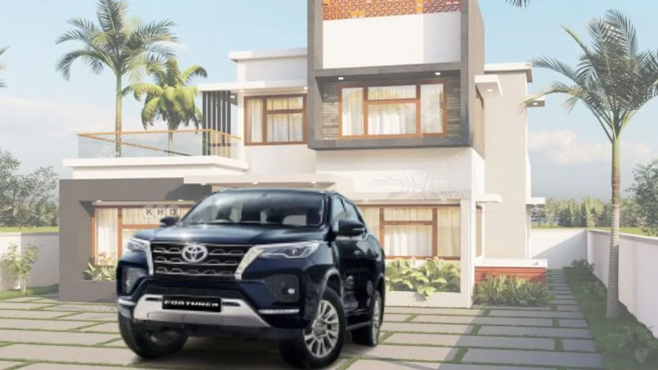 Toyota Fortuner in black color parked at a luxury home